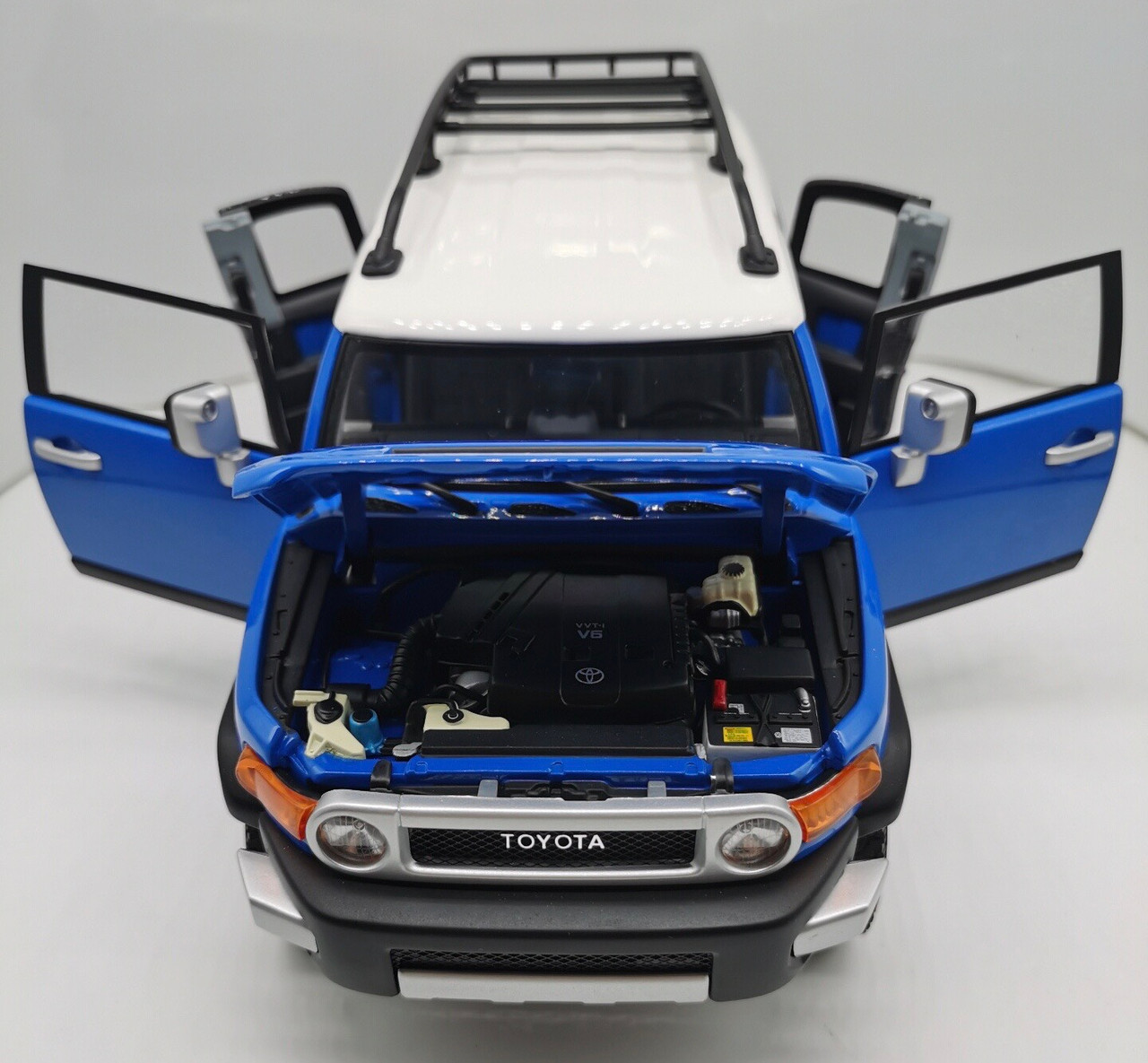 TOYOTA FJ CRUISER - BLUE W/WHITE ROOF AND RACK BY AUTOART