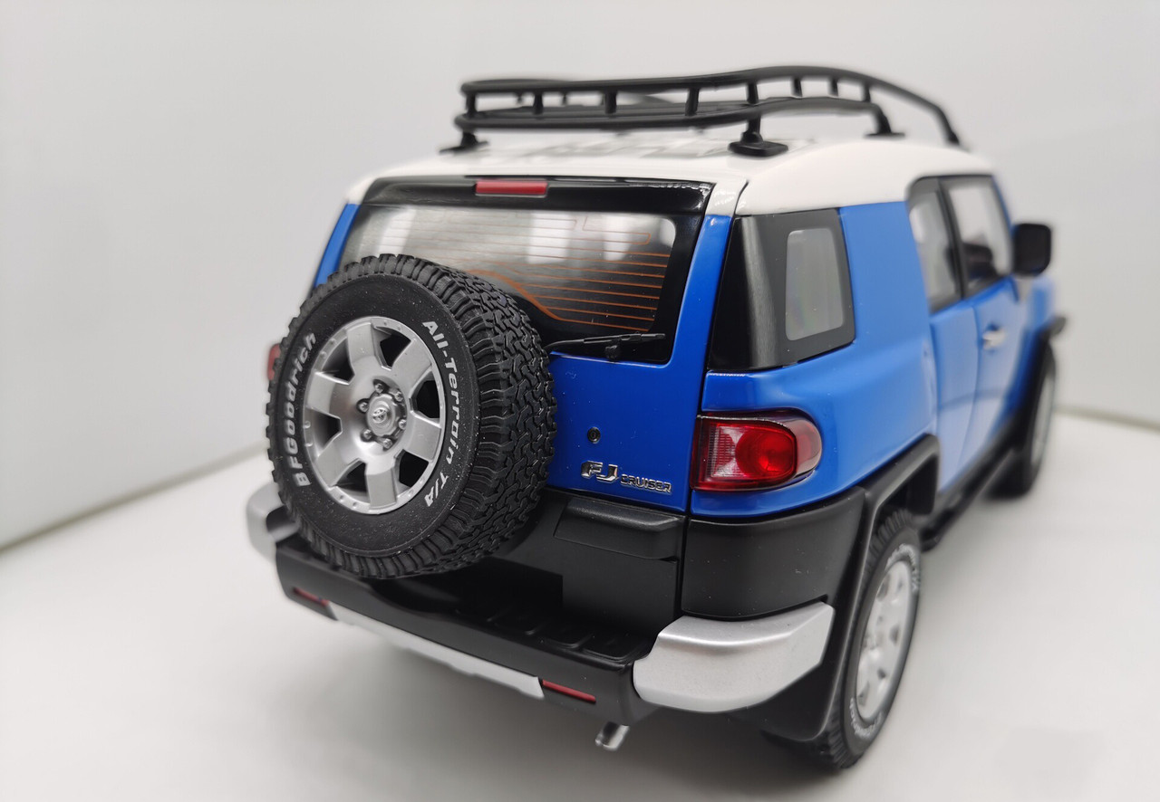 TOYOTA FJ CRUISER - BLUE W/WHITE ROOF AND RACK BY AUTOART
